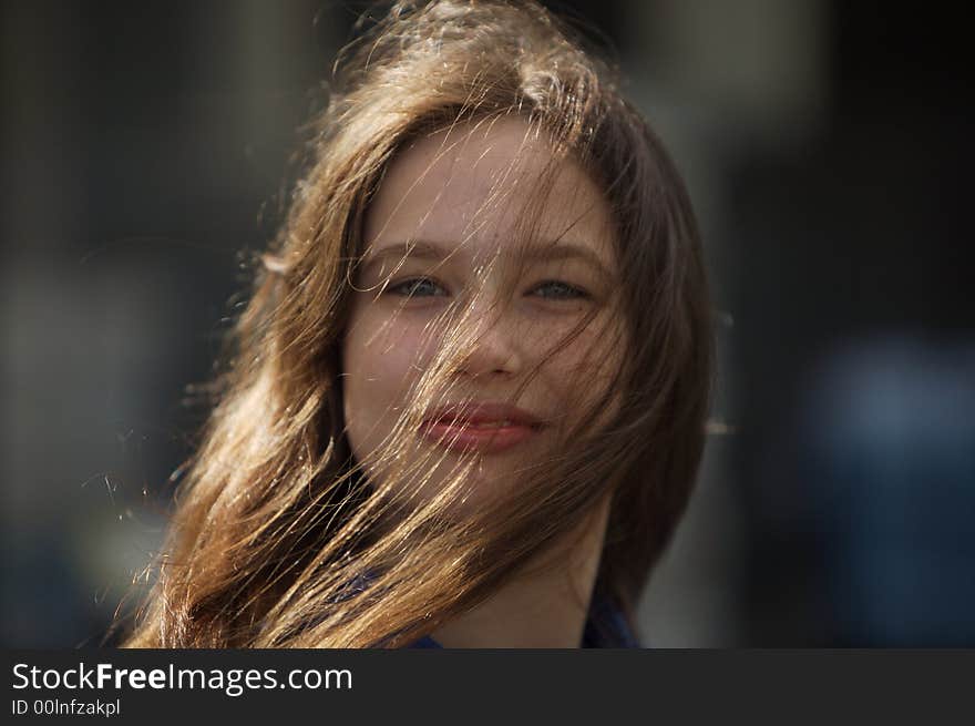 Young Girl with long her long brown hair in her face