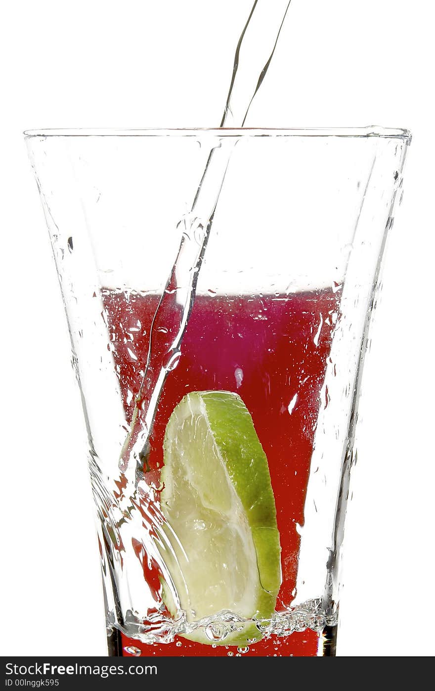 Glass with juice and lime on the white background