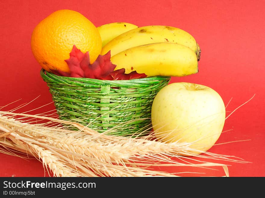 Food and green basket with red background. Food and green basket with red background