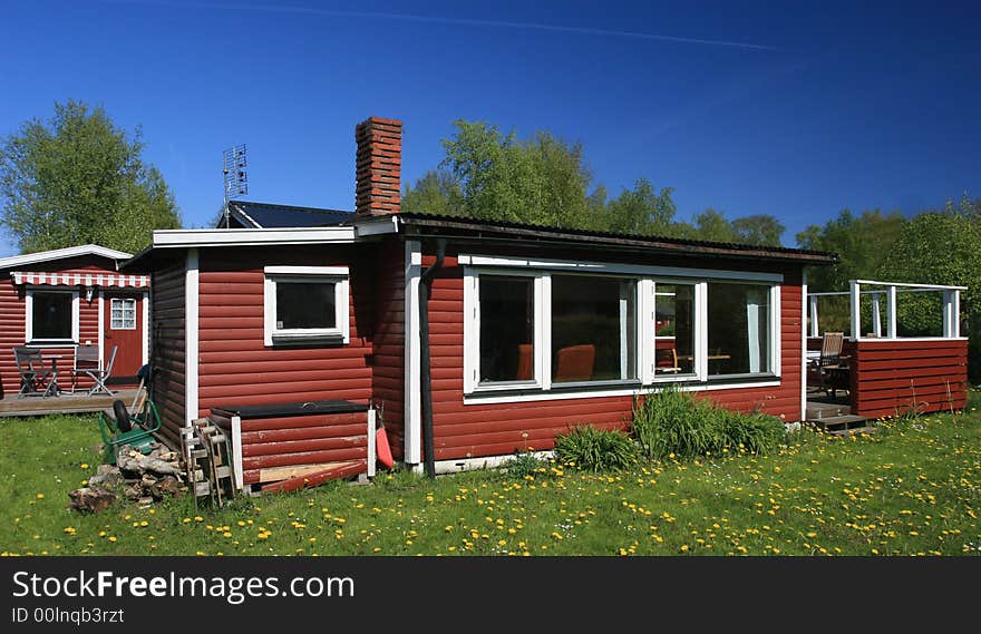 A red summer house in need of some fixing up