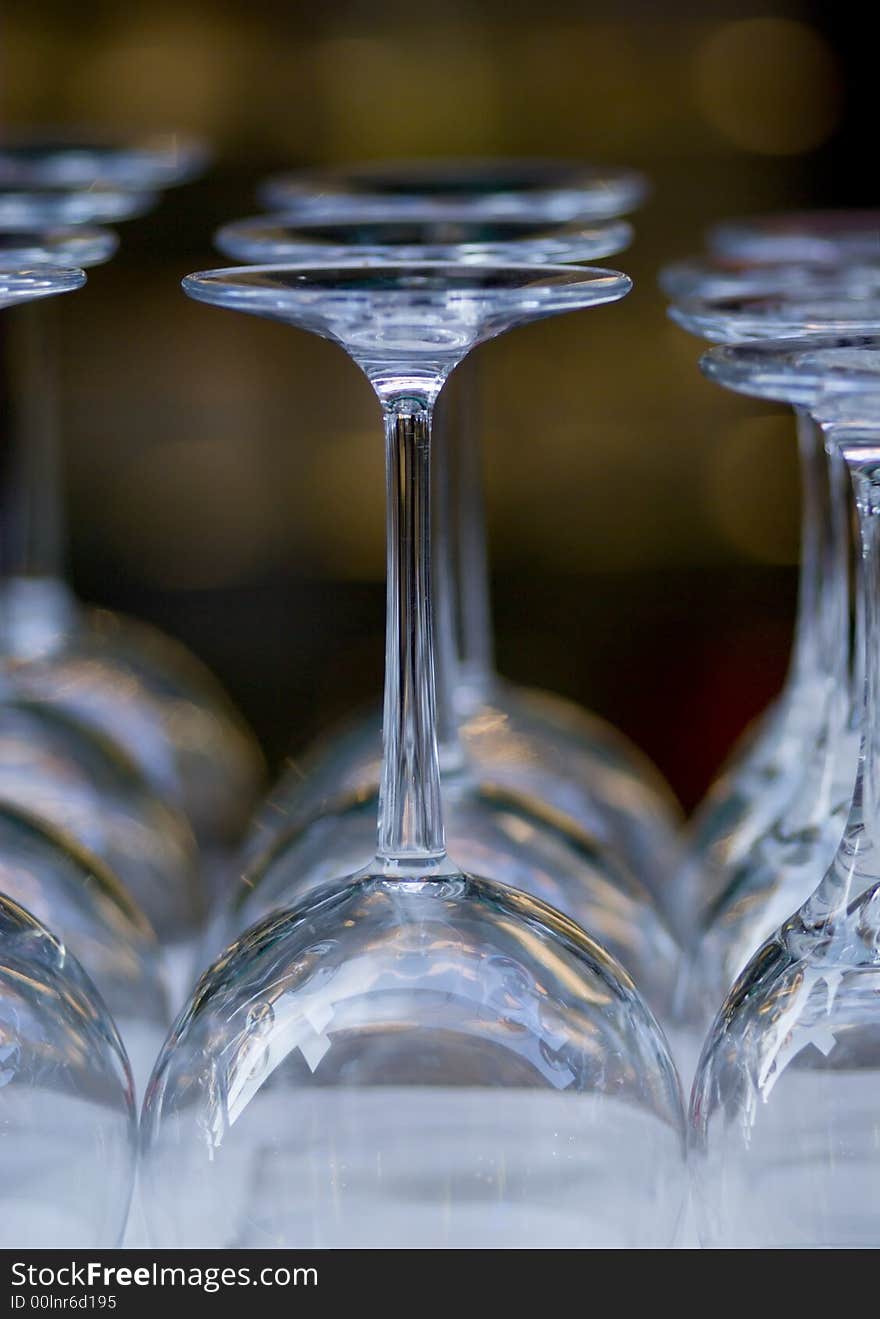 Empty Wine glasses in a row. Shallow depth of field. FOcus on the first row
