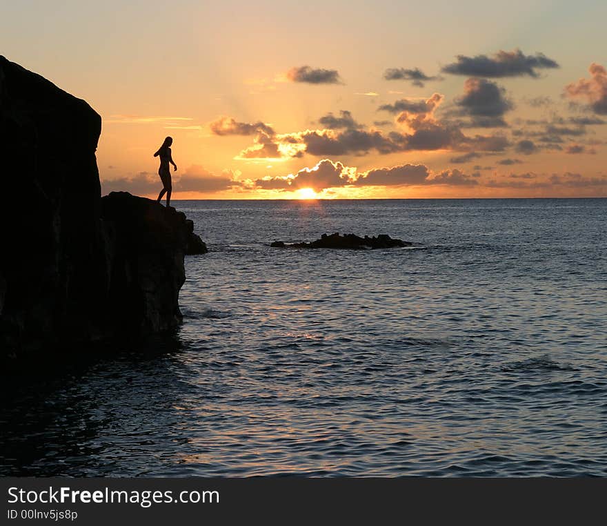 Sunset at Jump Rock in Wainea Bay beach, Hawaii