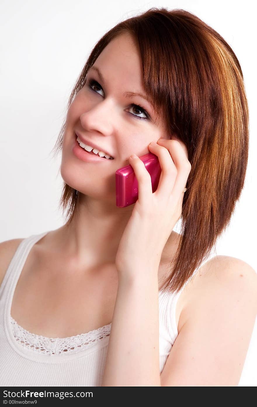 Close up of a teen girl talking on the phone. Close up of a teen girl talking on the phone.