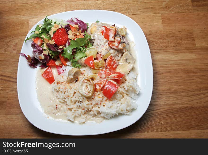 Plate of ready to eat chicken with rice and salad. Plate of ready to eat chicken with rice and salad