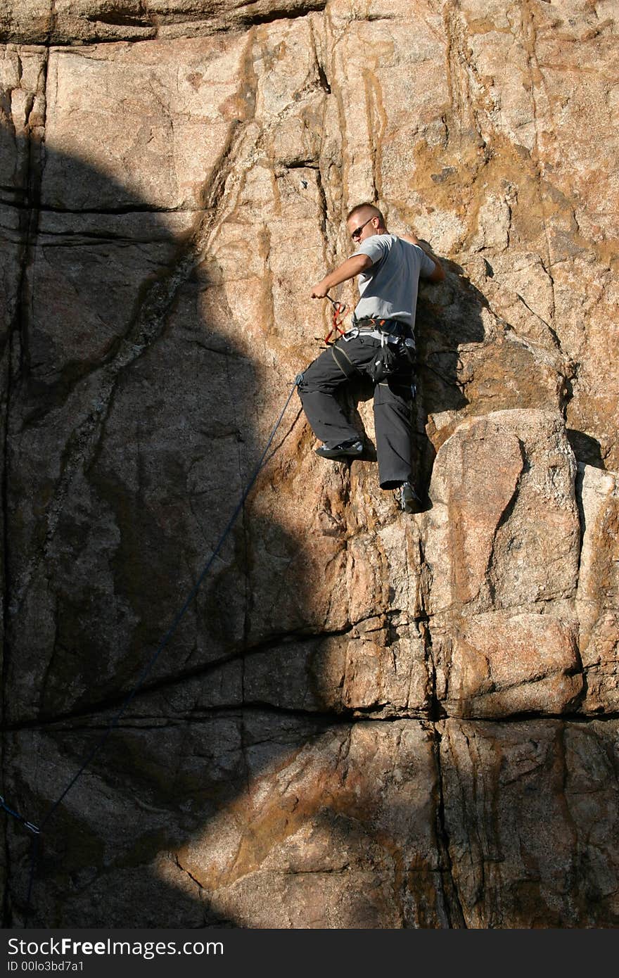 Climber leading a climb in Prescott Arizona along Watson Lake's Granite Dells. Climber leading a climb in Prescott Arizona along Watson Lake's Granite Dells.