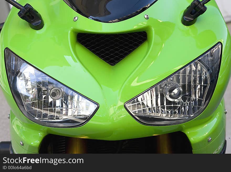 Close up view of the green motor headlights. Close up view of the green motor headlights.