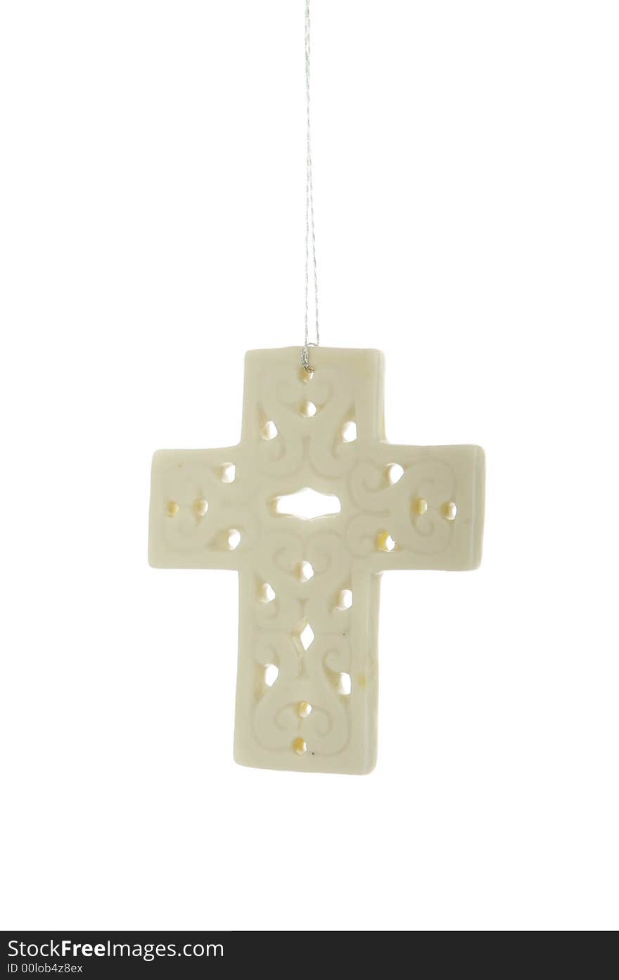 An image of a white cross Christmas ornament. An image of a white cross Christmas ornament