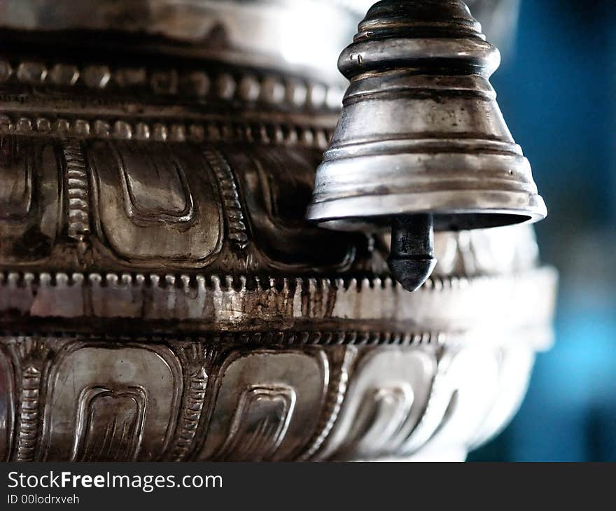 Phallic shaped clapper of bell as part of an object used in religious worship in an Indian temple. Phallic shaped clapper of bell as part of an object used in religious worship in an Indian temple