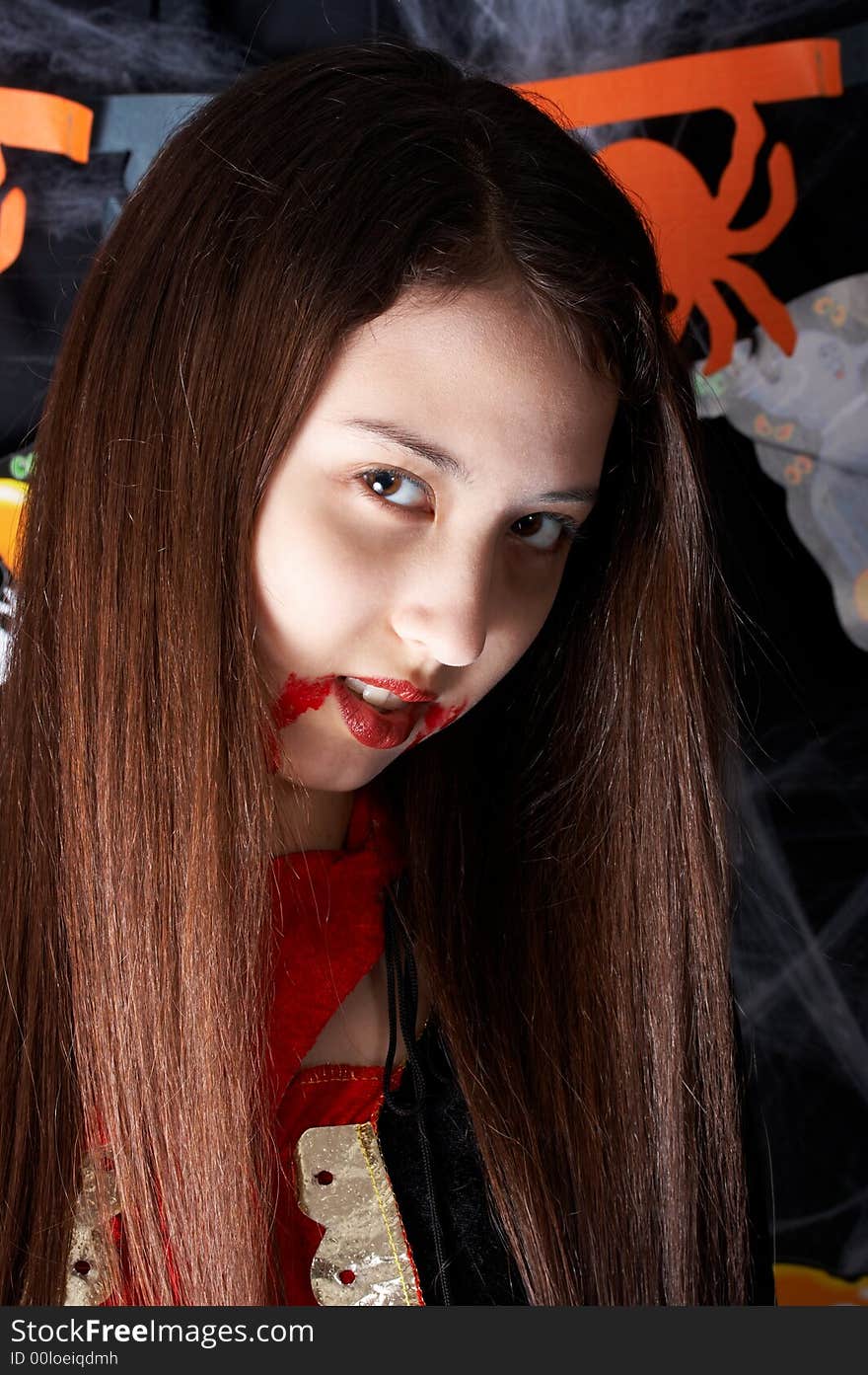 A young female dressed in a halloween costume