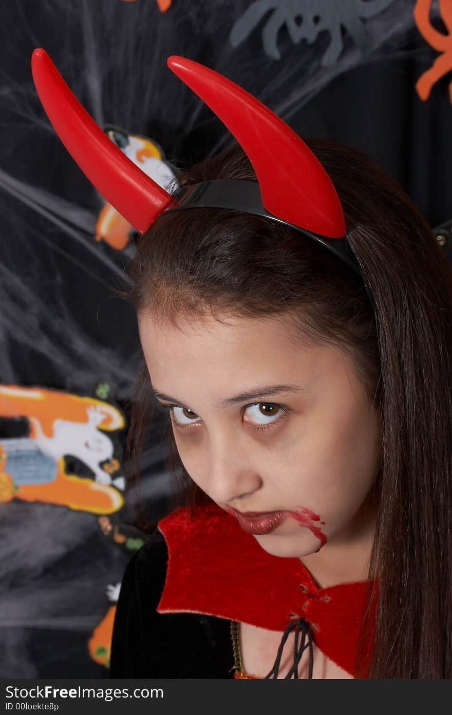 A young female dressed in a halloween costume