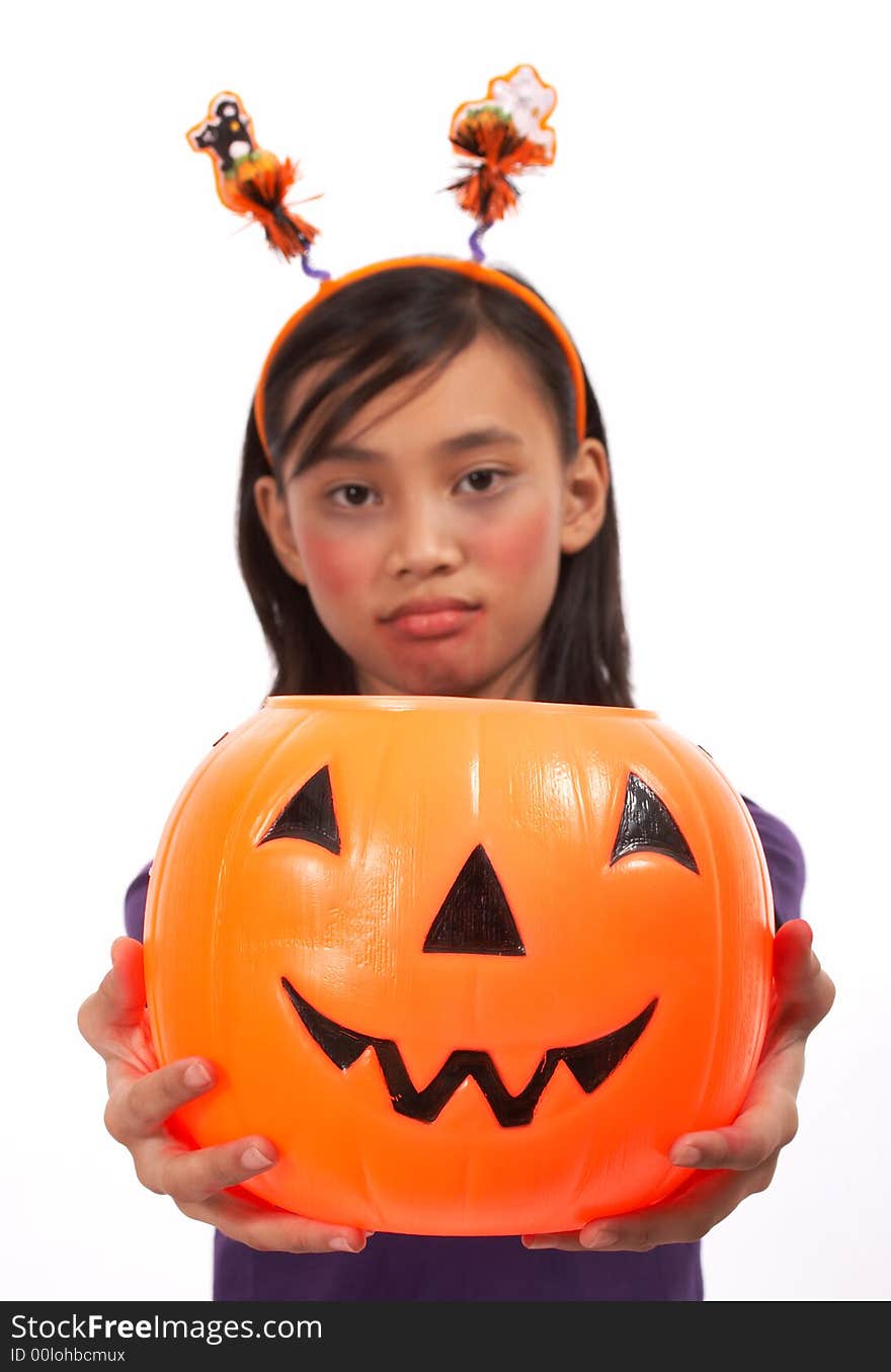 A sad face girl holding a pumpkin over a white background. A sad face girl holding a pumpkin over a white background