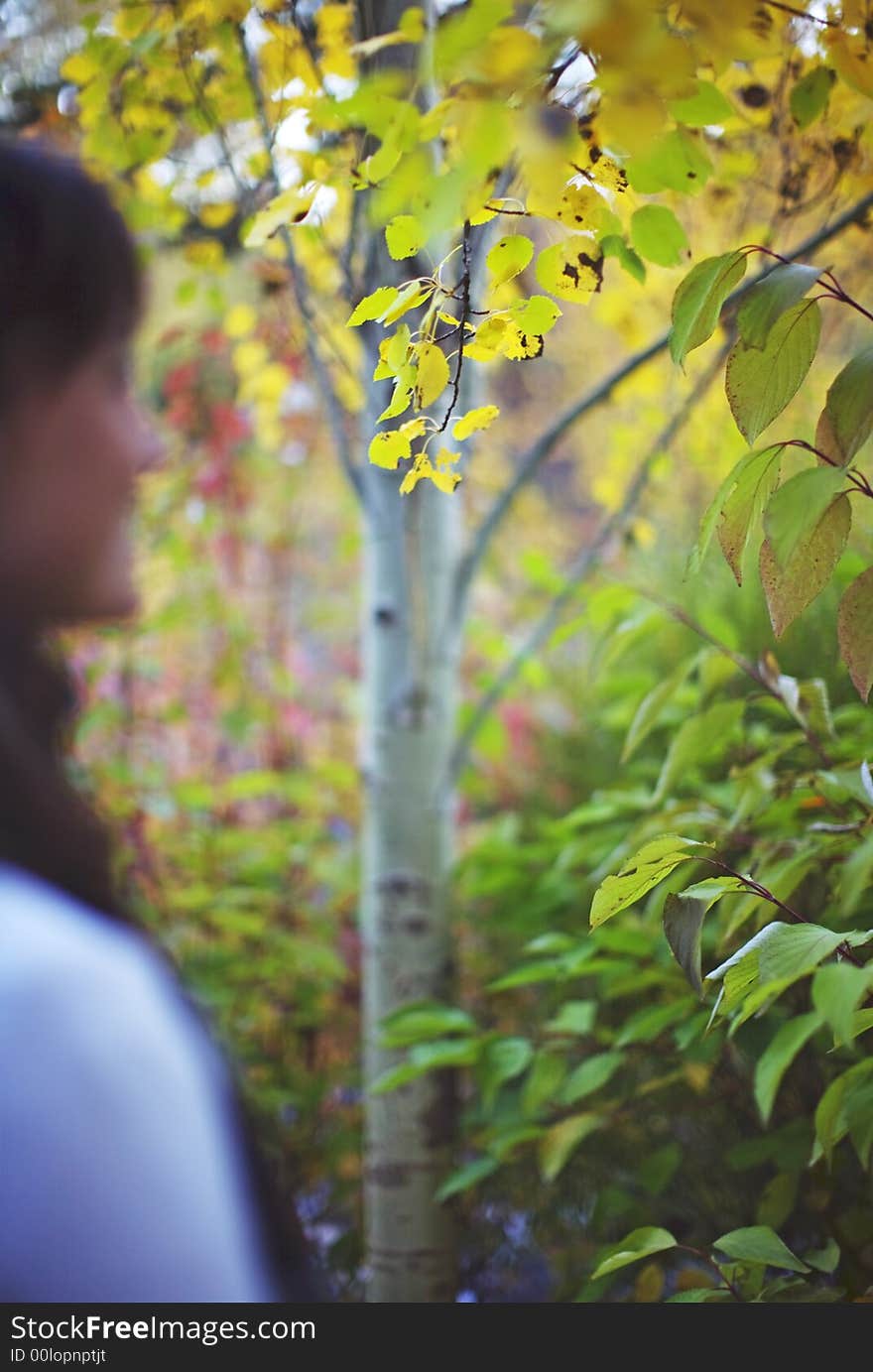 One young woman next to tree. One young woman next to tree