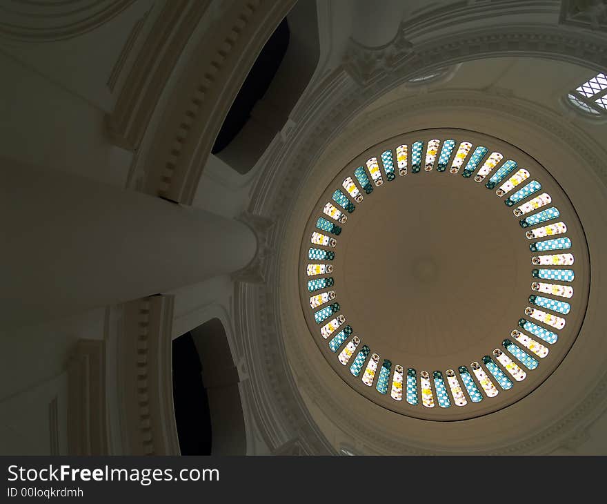 High dome ceiling with stained glass panels and column in the national Museum of Singapore. High dome ceiling with stained glass panels and column in the national Museum of Singapore.