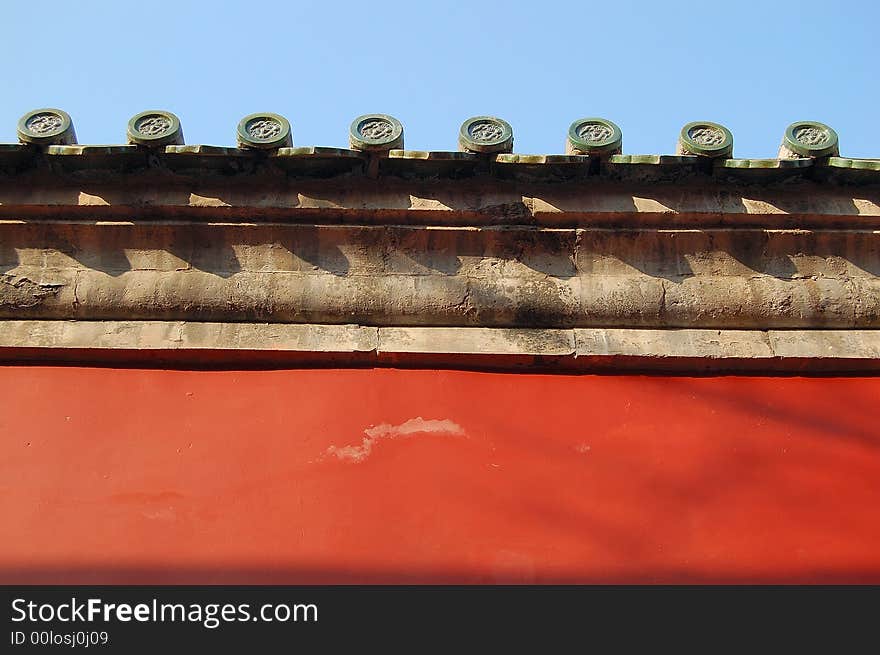 Top of a traditional chinese red wall.