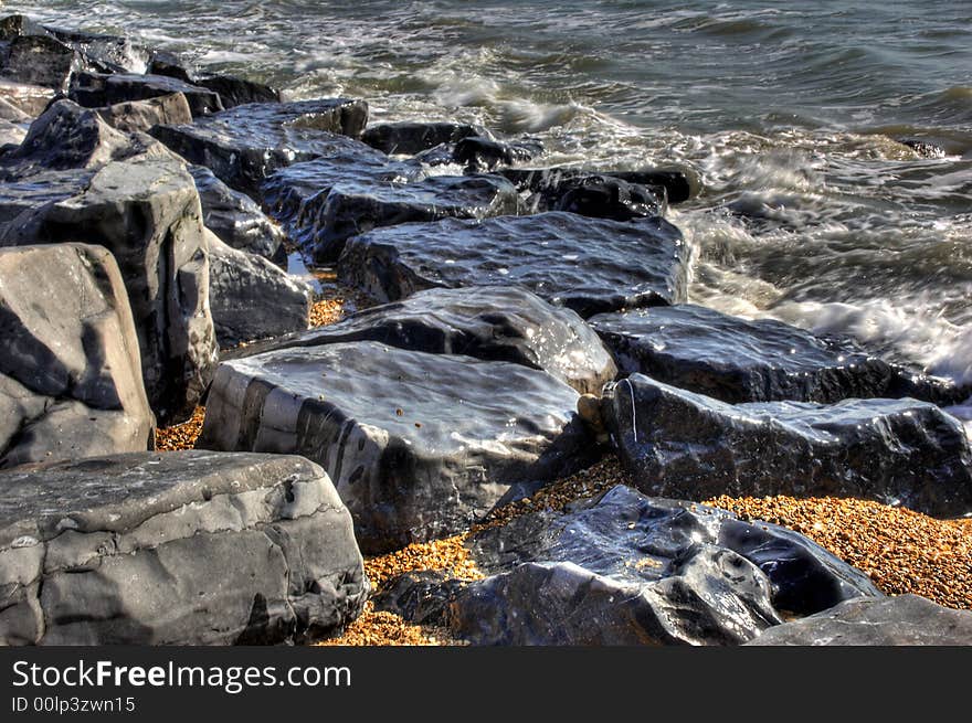 High Definition effect of rugged rocks on shoreline. High Definition effect of rugged rocks on shoreline