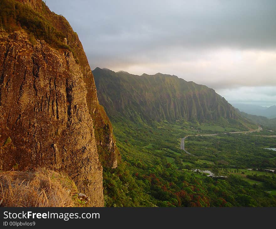 High on top of the mountains of Oahu looking over the lush vegetation. High on top of the mountains of Oahu looking over the lush vegetation.