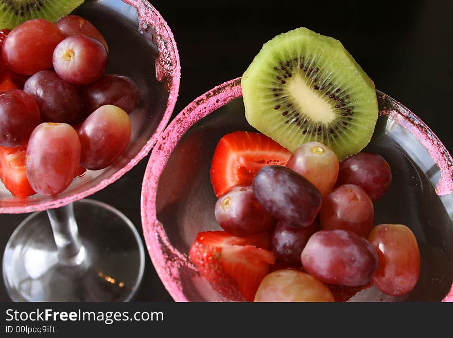 Fruit Salad in glasses with sugar crystals on the rim. Fruit Salad in glasses with sugar crystals on the rim