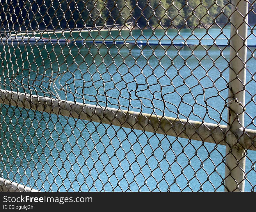 A shot of a fence with a pattern that has been bent. A shot of a fence with a pattern that has been bent.