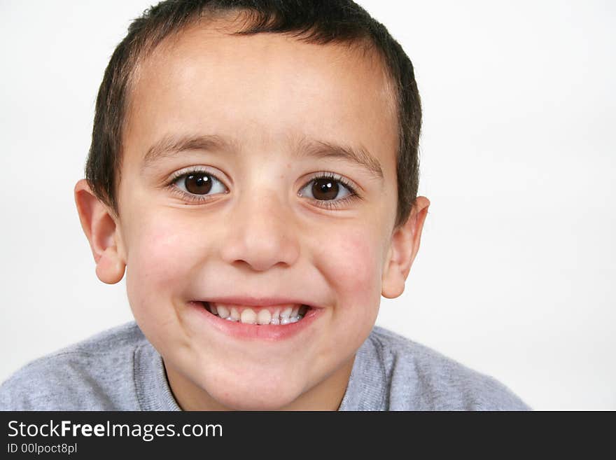 A young boy smiling at the camera