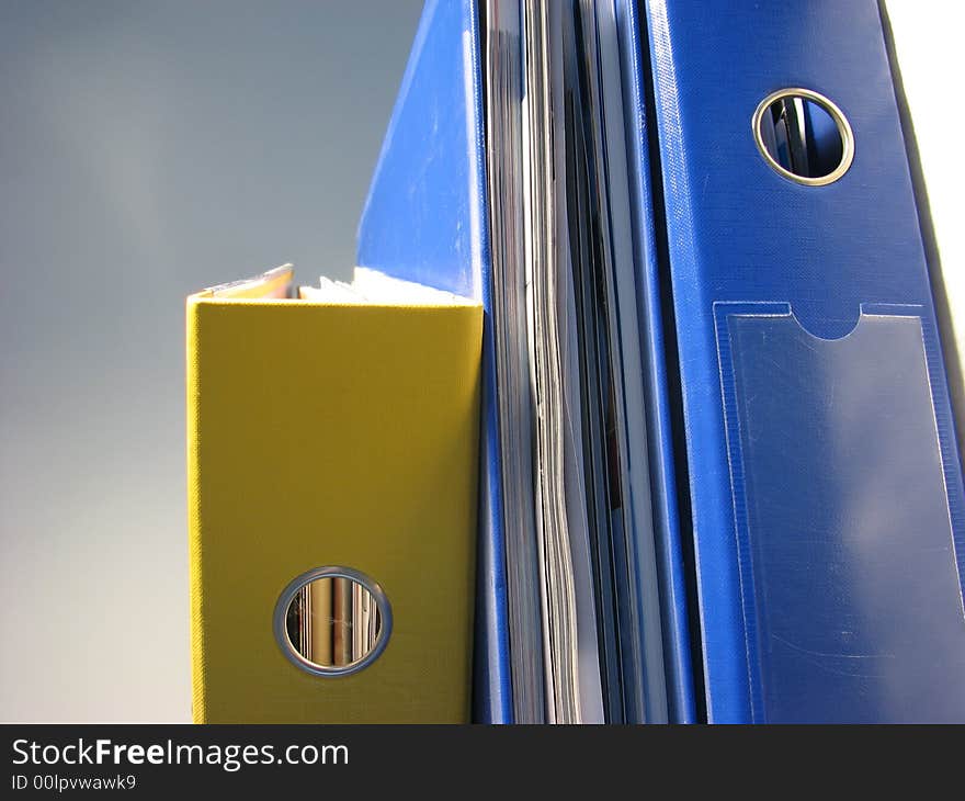 Stressed stack of papers office files.