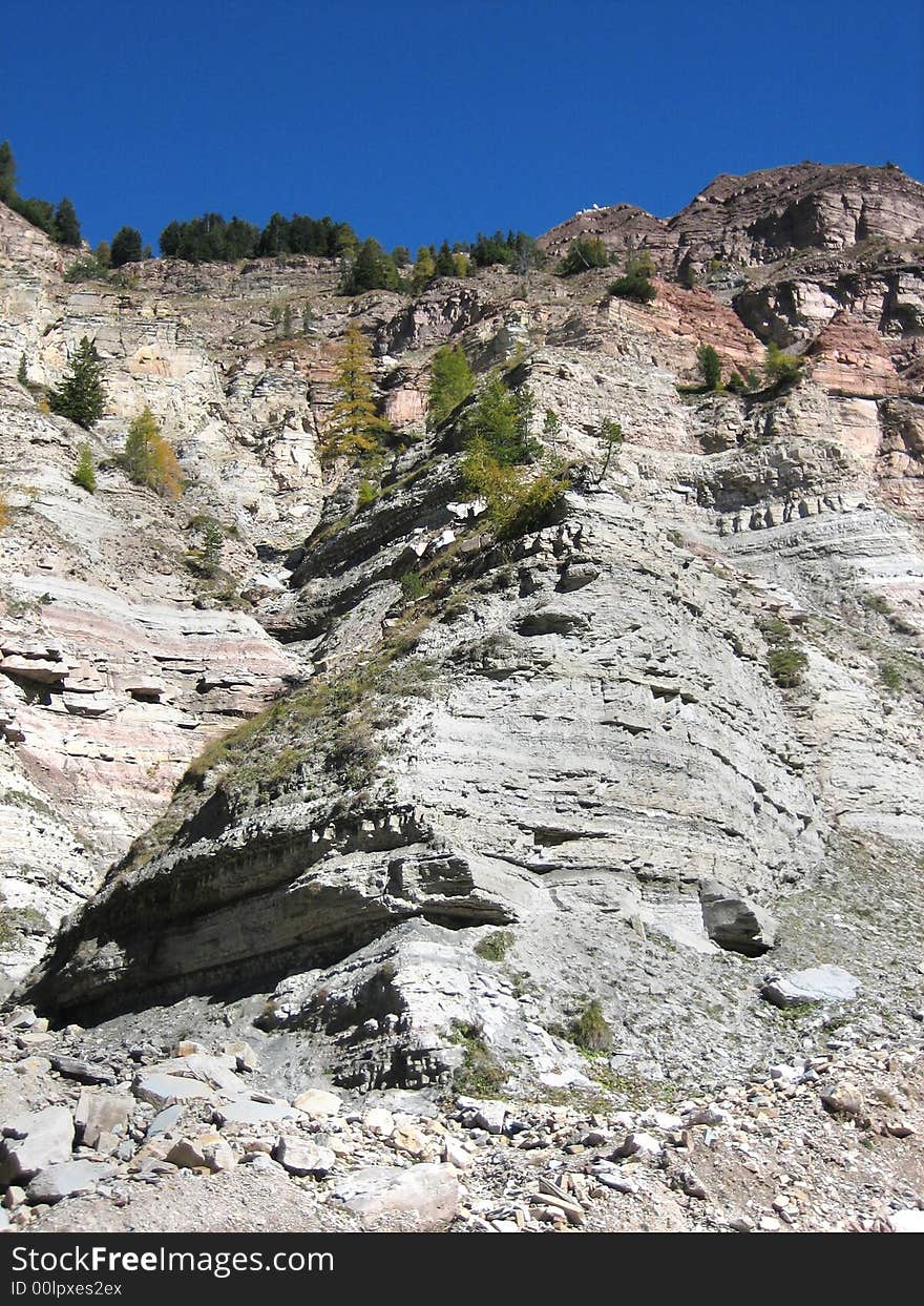 Hillside in the mountains in nature with rocks grass and other plants. Hillside in the mountains in nature with rocks grass and other plants