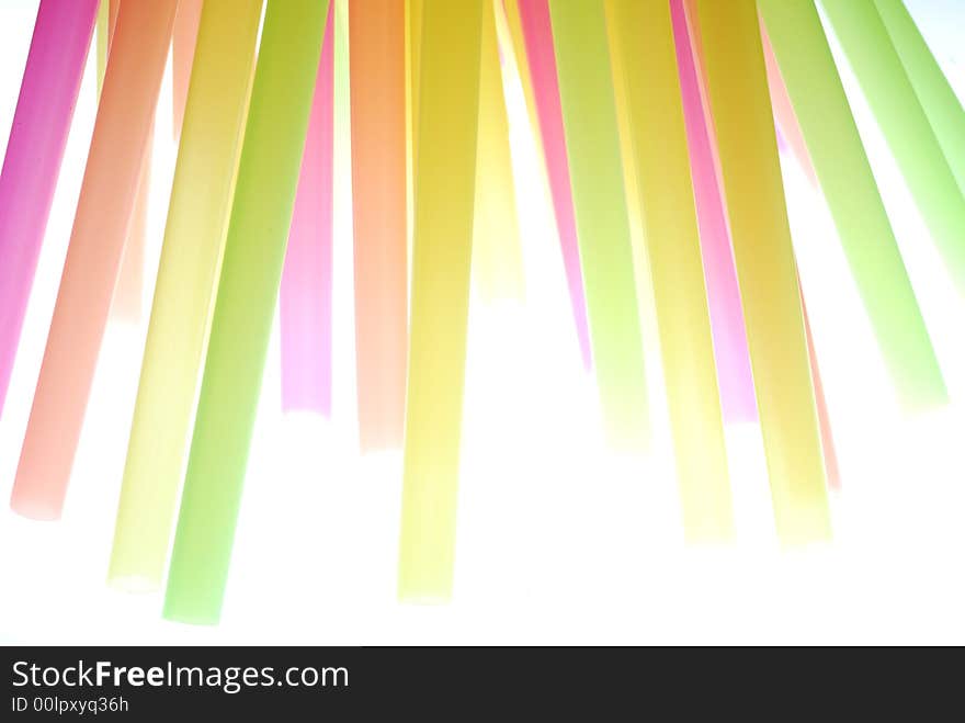 Color drinking straw standing on light box