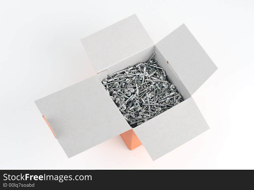 Rivets in a paper box. Rivets in a paper box