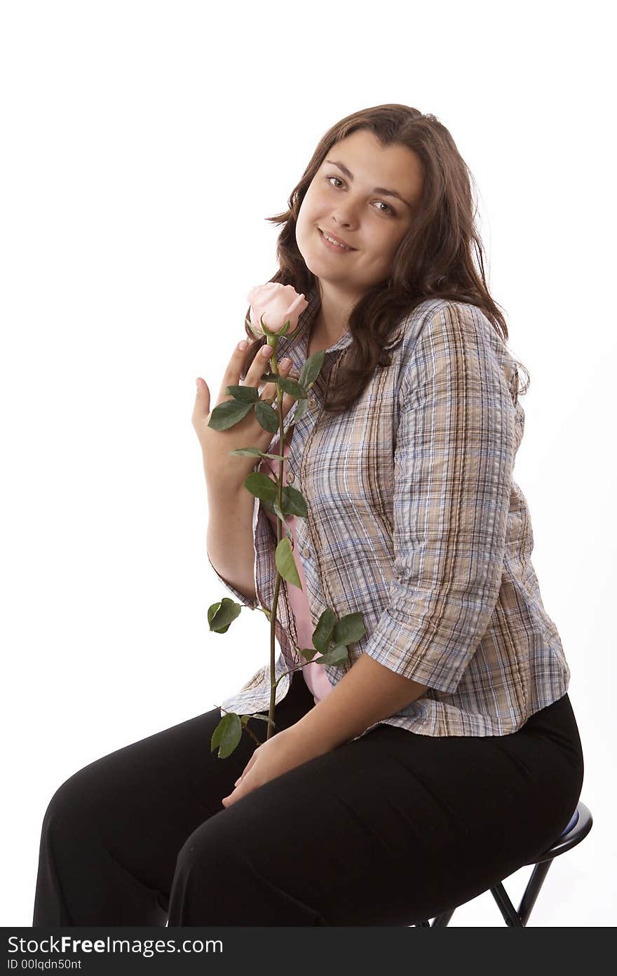 Portrait of a young woman isolated on white with flower