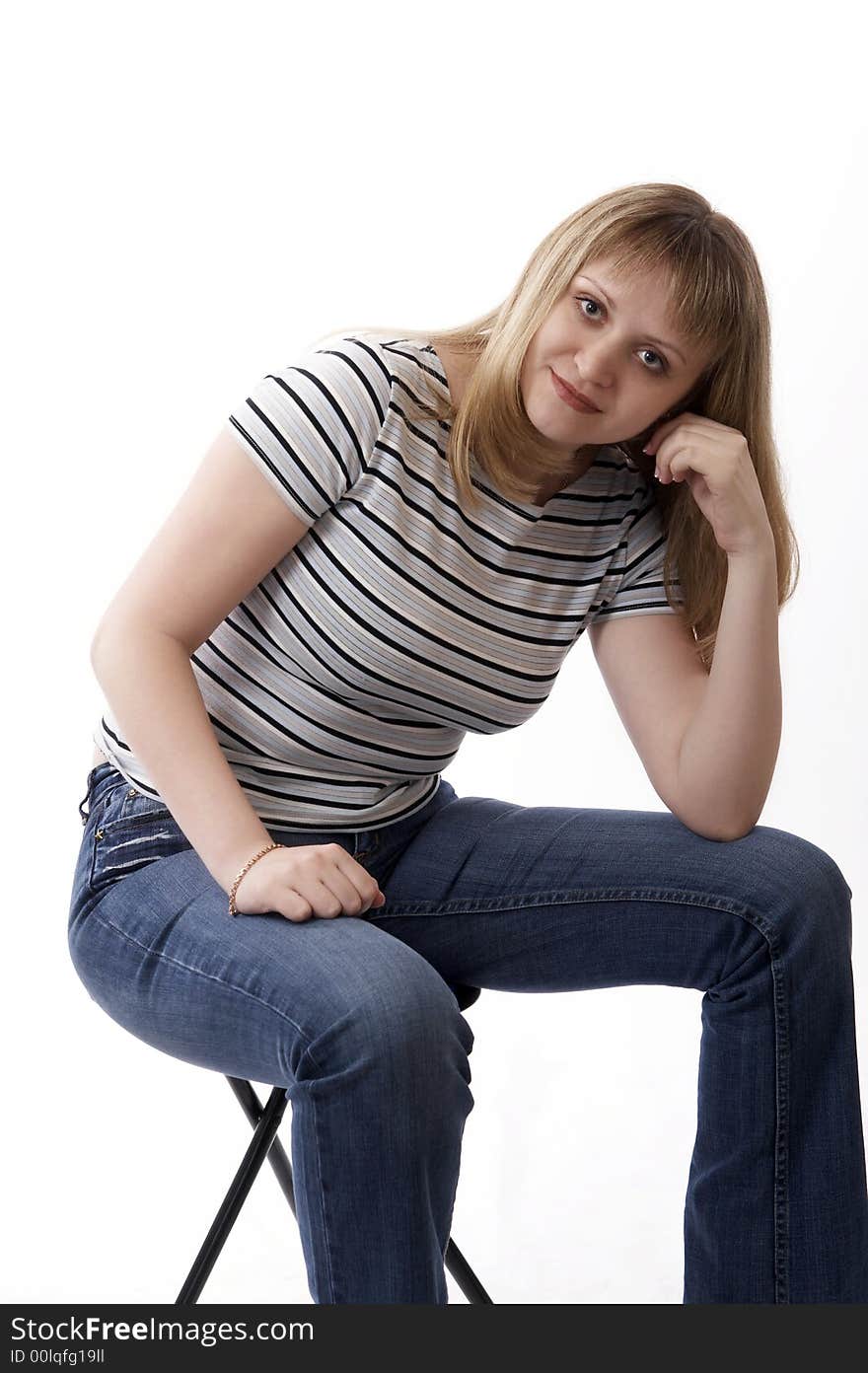 Woman sitting on a chair isolated on white