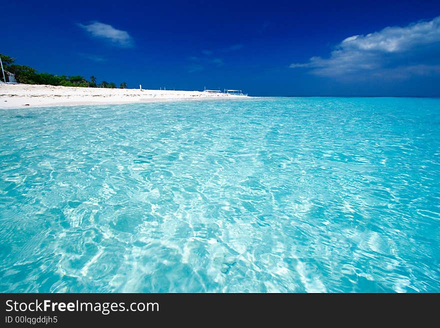 Ocean View of beautiful pacific blue water beside a tropical island with white sand. Ocean View of beautiful pacific blue water beside a tropical island with white sand