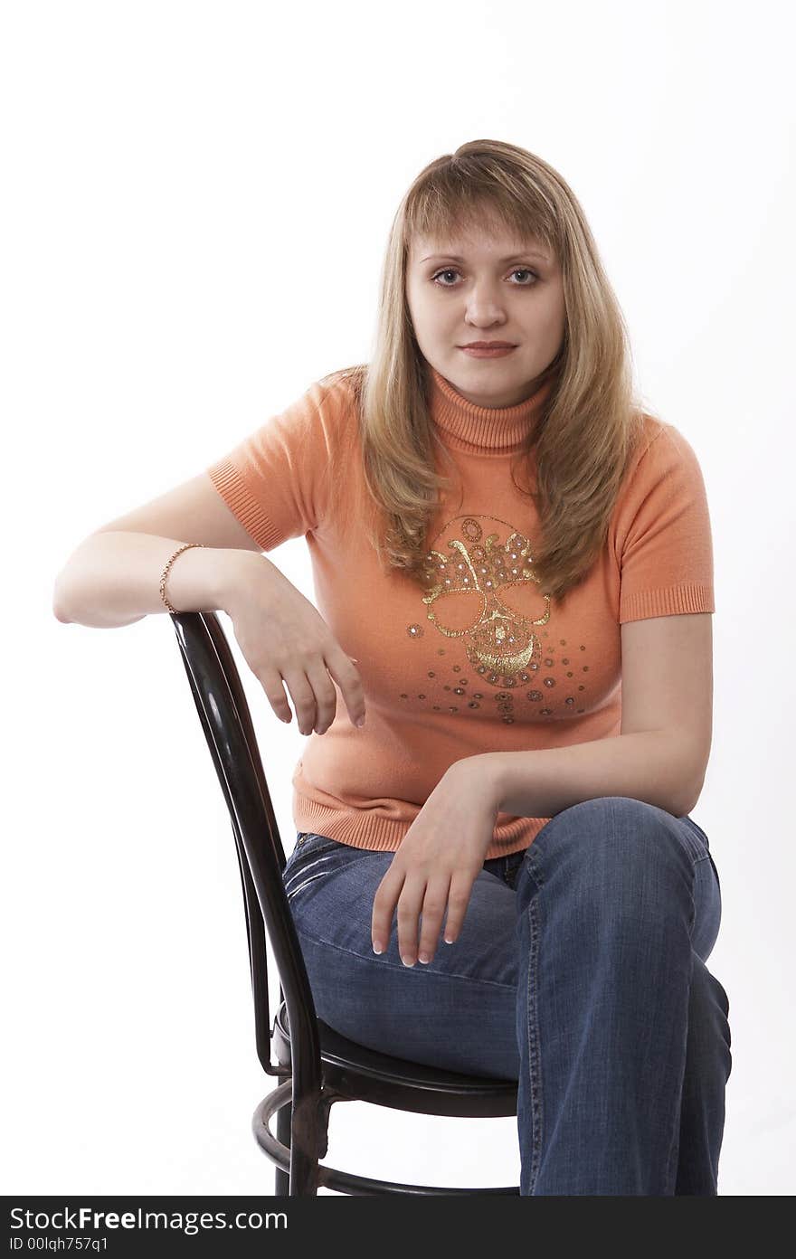 Woman sitting on a chair isolated on white