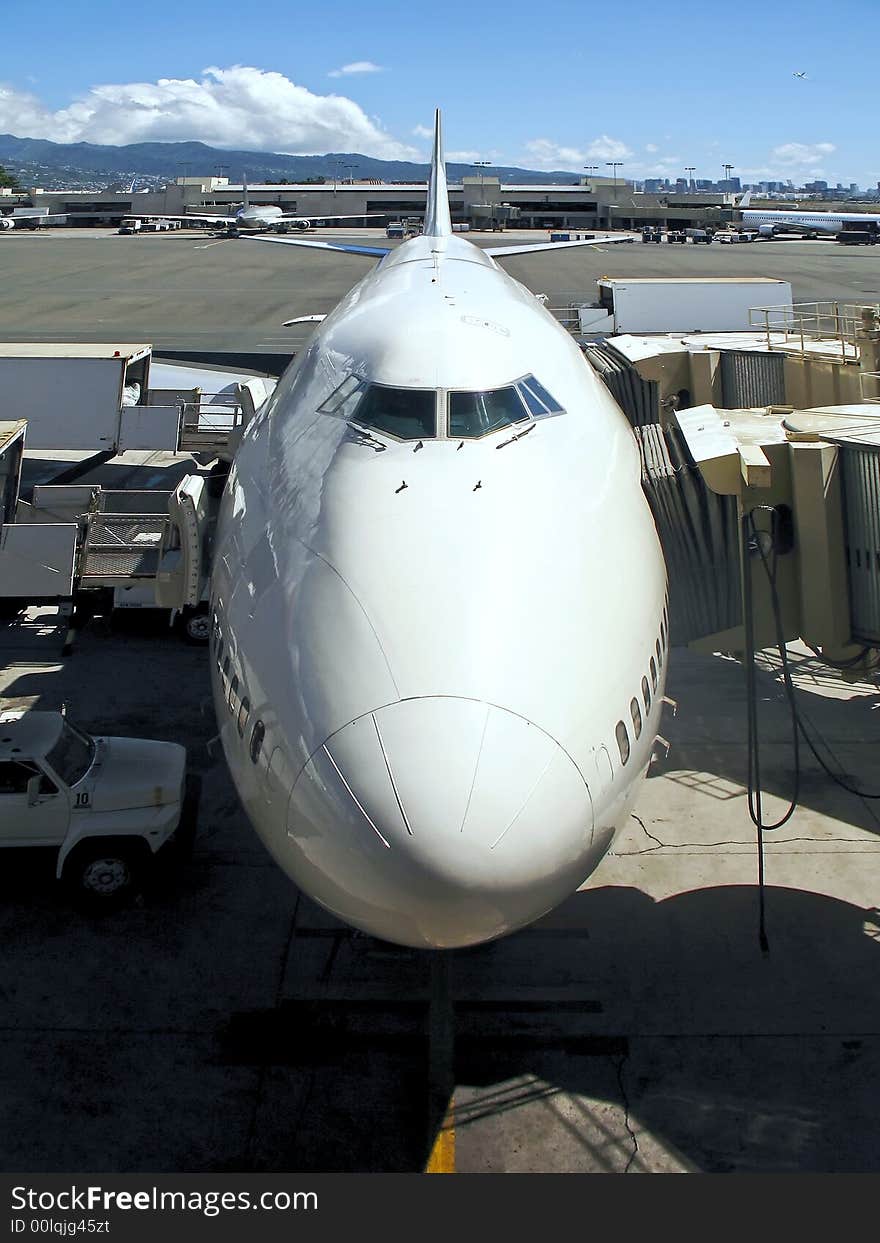 Nose of commercial jetliner parked at terminal gate. Nose of commercial jetliner parked at terminal gate