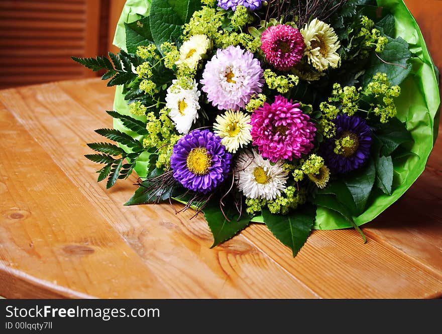 Aster flower bouquet on wooden table. Aster flower bouquet on wooden table