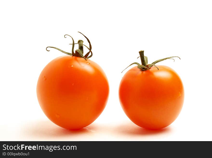 Close up of two red round tomato on white background. Close up of two red round tomato on white background