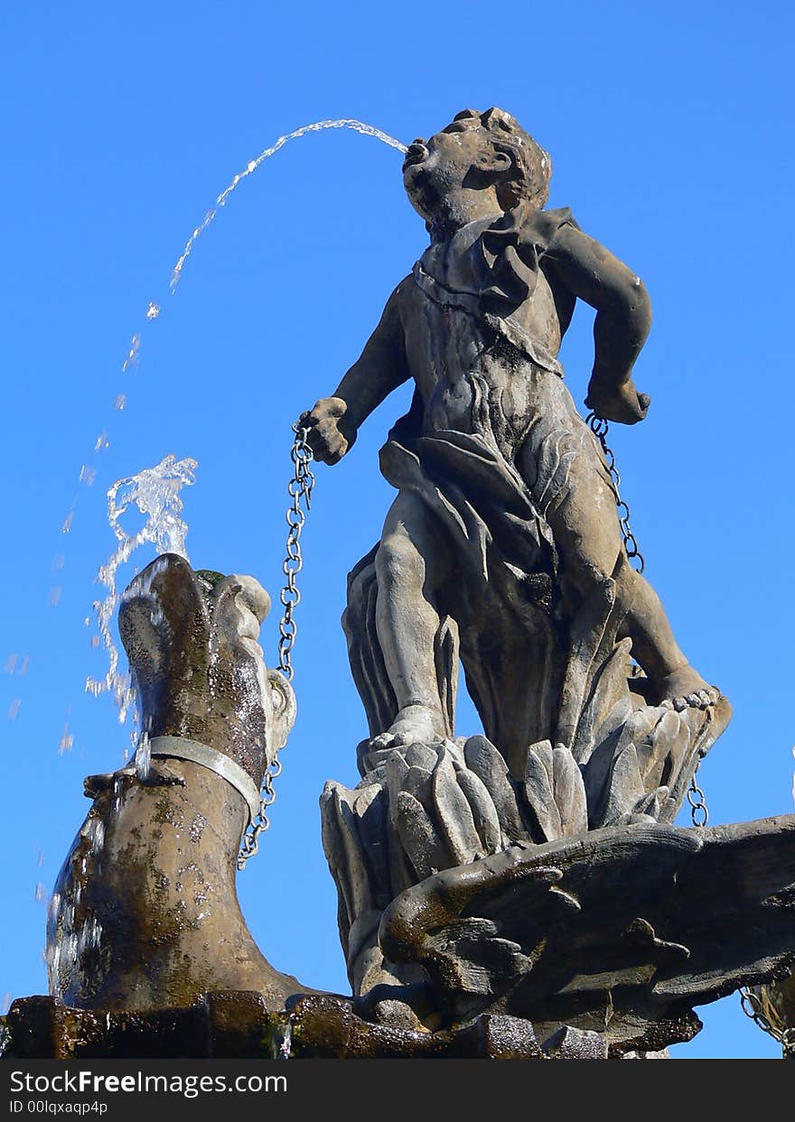 Public fountain boy and dragon