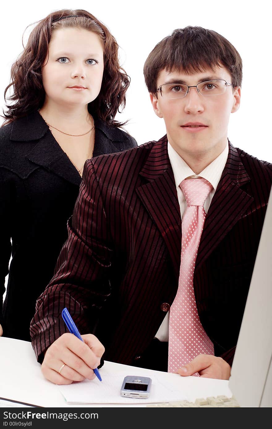 Group of business people working together. Shot in studio. Group of business people working together. Shot in studio.