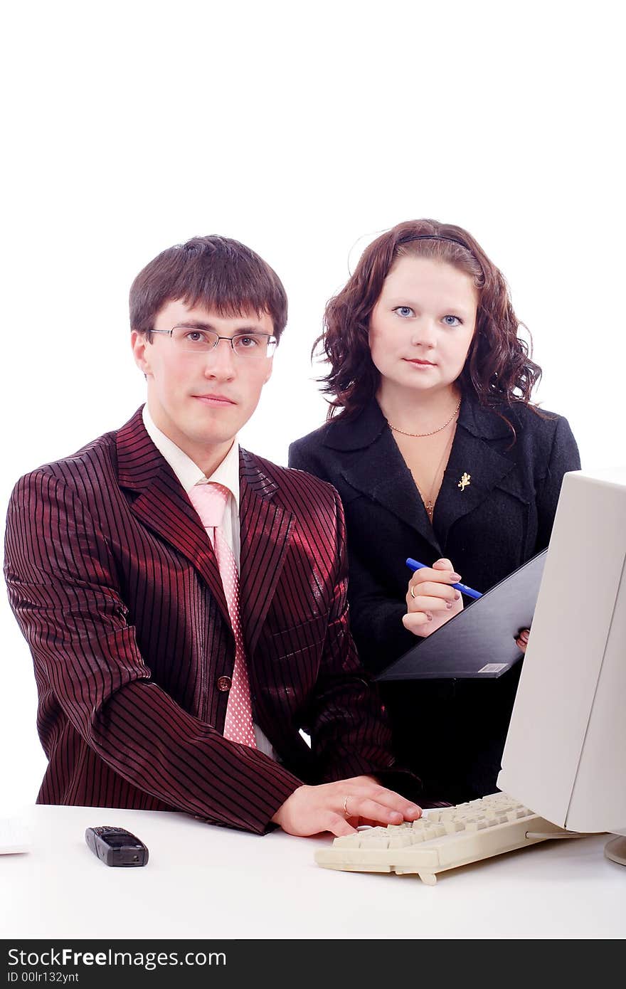 Group of business people working together. Shot in studio. Group of business people working together. Shot in studio.