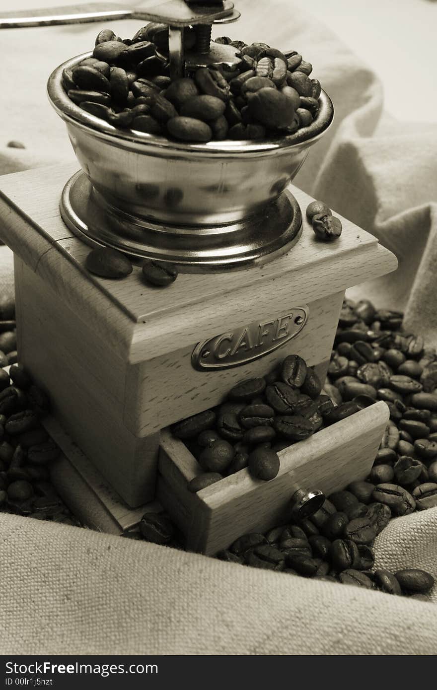 Coffee background: Close-up of a beans, cup, mill. Coffee background: Close-up of a beans, cup, mill