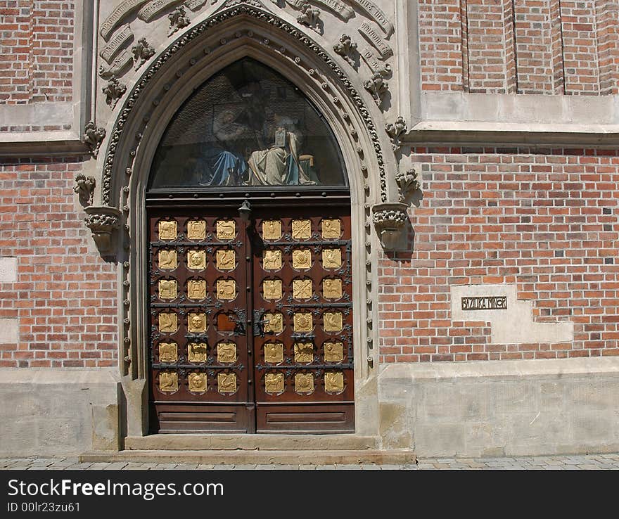 Big old wooden door with a portal nicely decorated