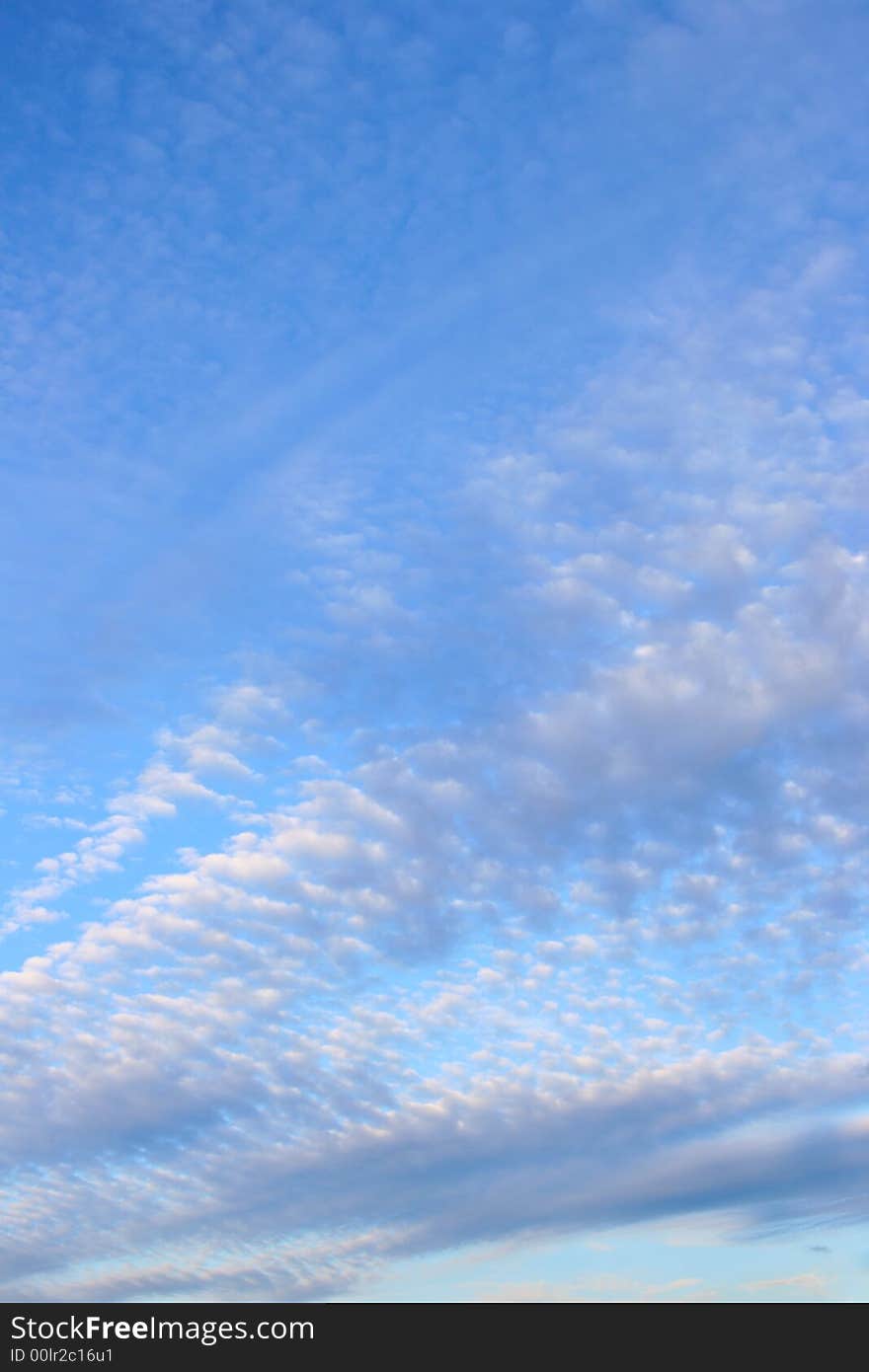 Fleecy clouds at evening, may be used as background