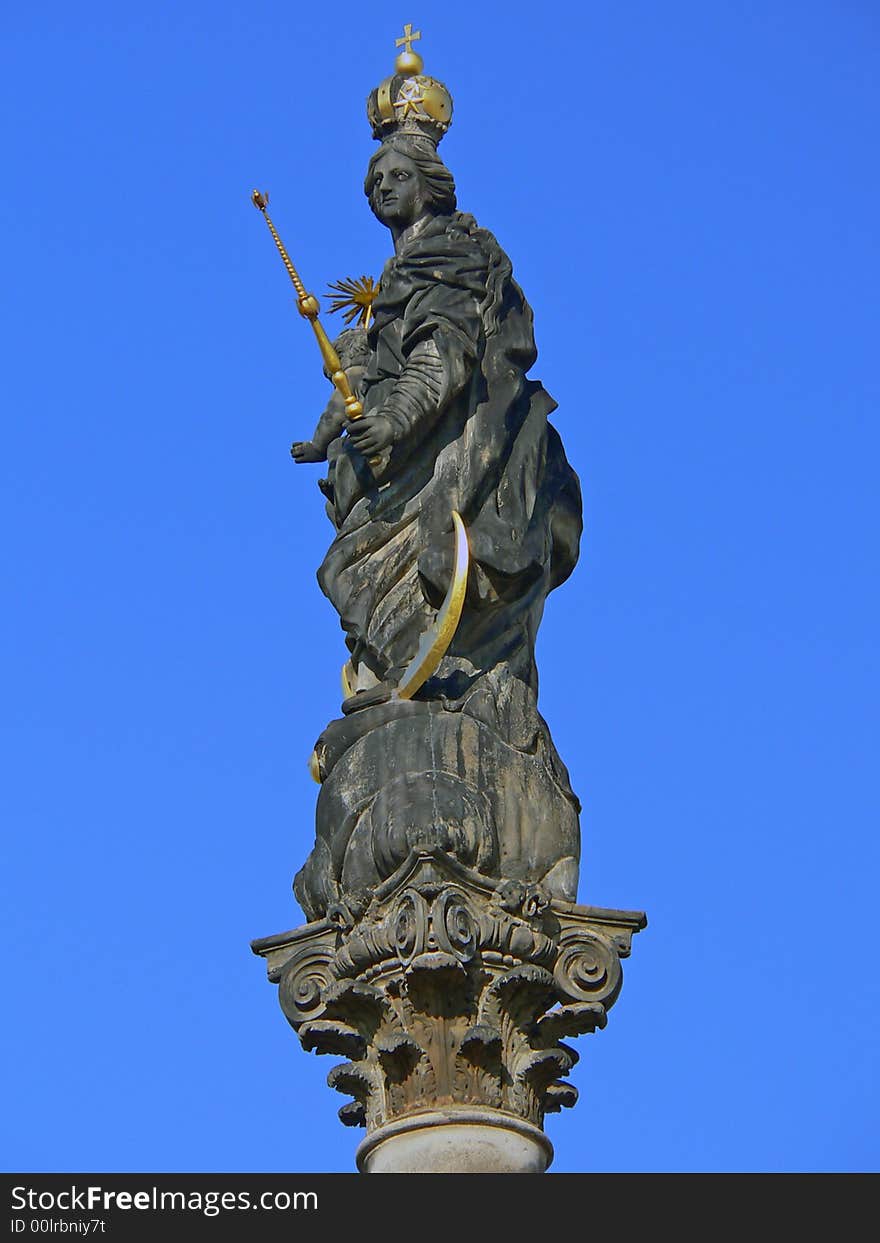 Statue holly on blue background sky