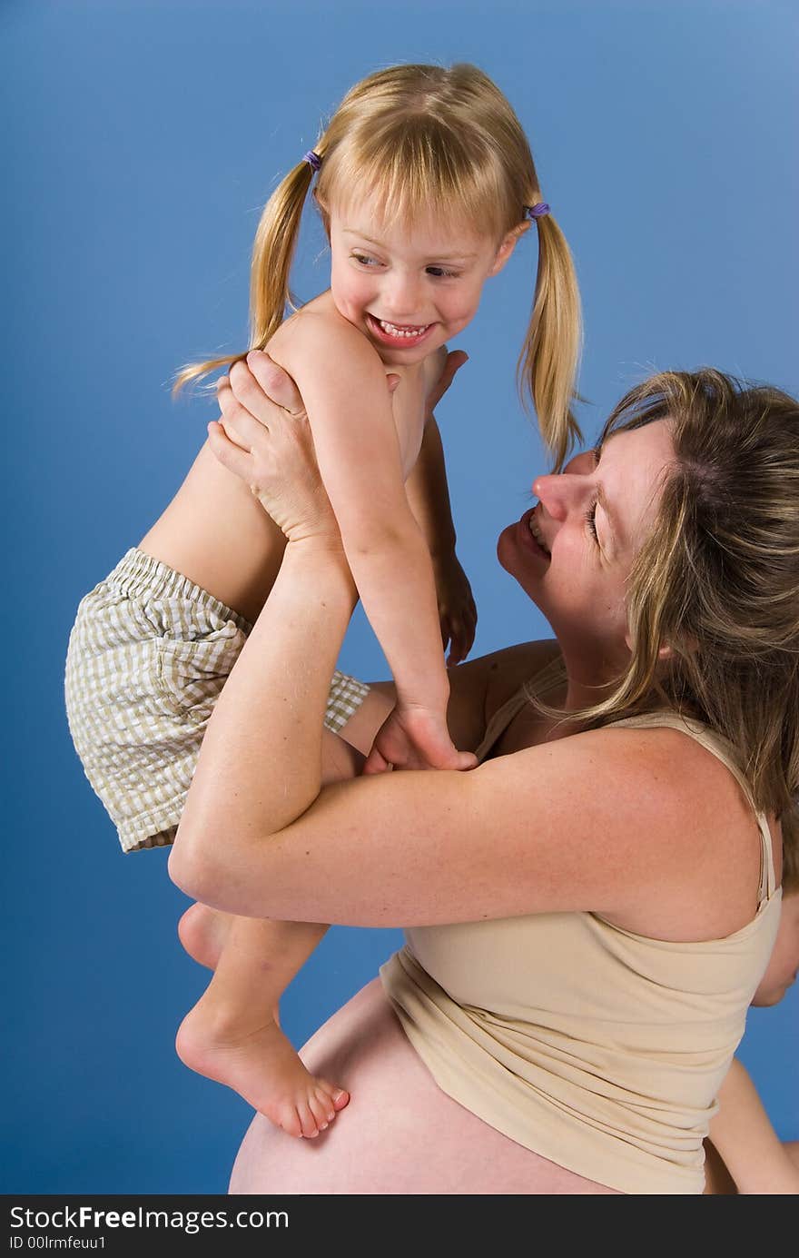 Mother and her kid playing in the air. Mother and her kid playing in the air