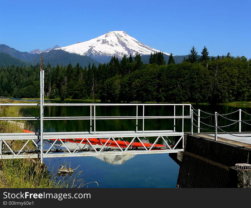 A shot of a small bridge with a mountain in the background. A shot of a small bridge with a mountain in the background.