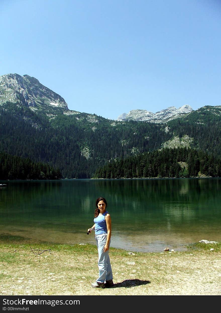 Girl On A Rock Near A Glacier Lake At Durmitor