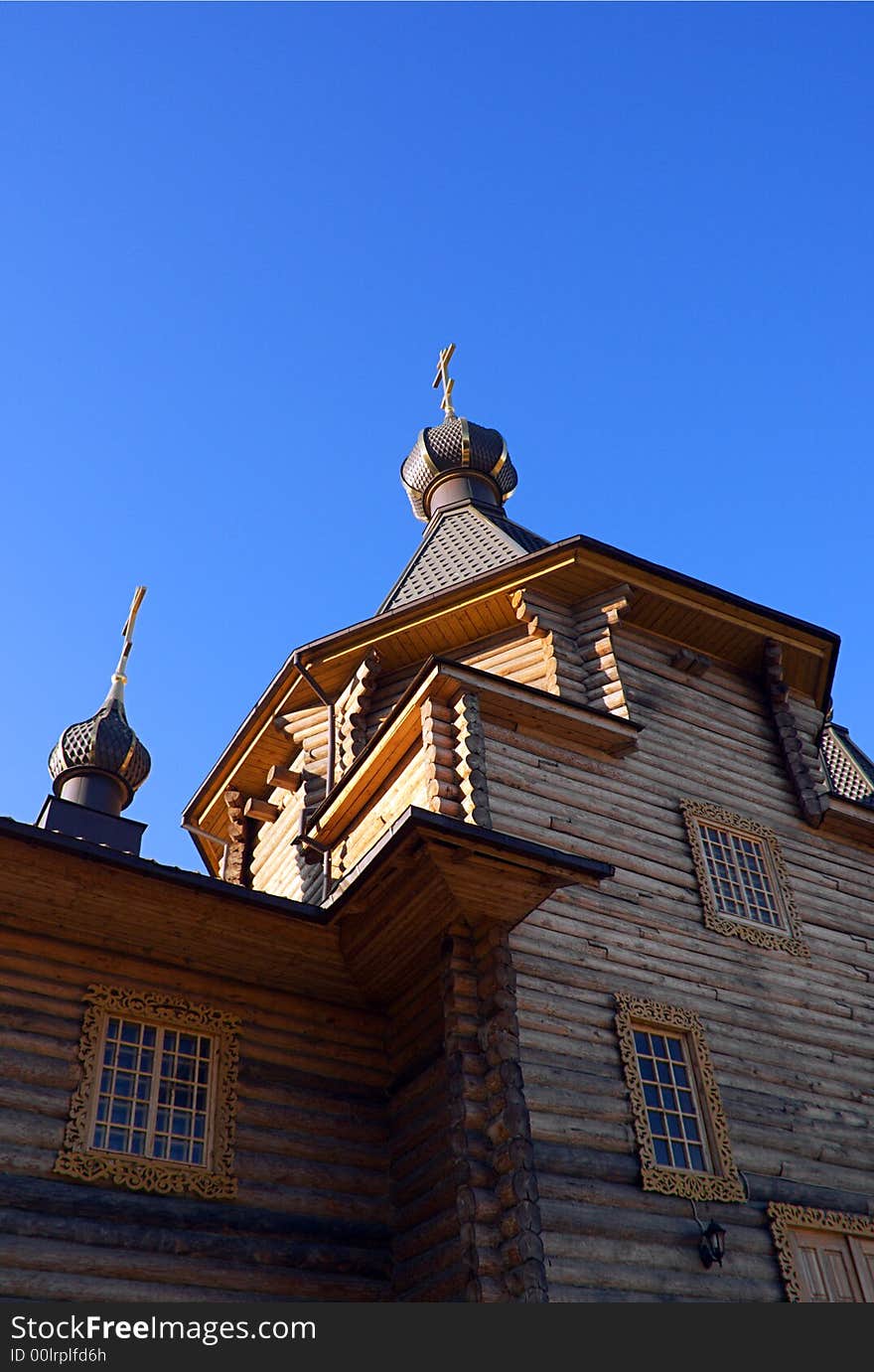 Wooden Christian church under the clear blue sky. Wooden Christian church under the clear blue sky.