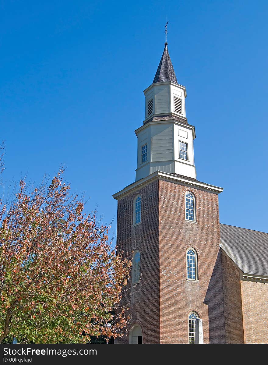 Tower and steeple of an eighteenth century brick church. Tower and steeple of an eighteenth century brick church.