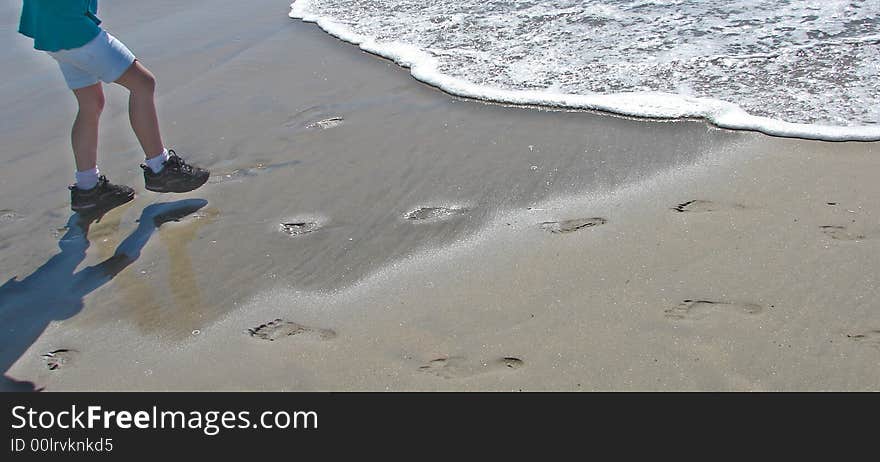 Playing at the ocean, trying to keep our shoes wet, watching our footprints fade into the sand. Playing at the ocean, trying to keep our shoes wet, watching our footprints fade into the sand.