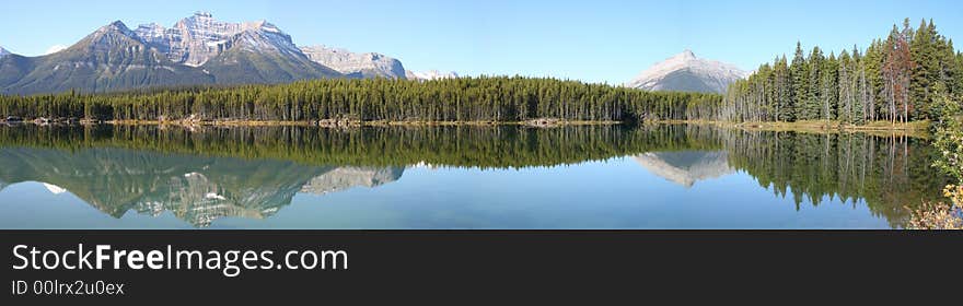 Reflexion of rockies mountains in the lake