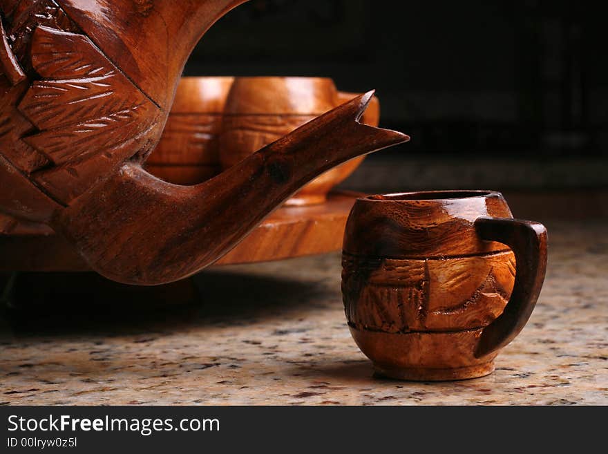 Wooden tea cup or coffee cup pouring.