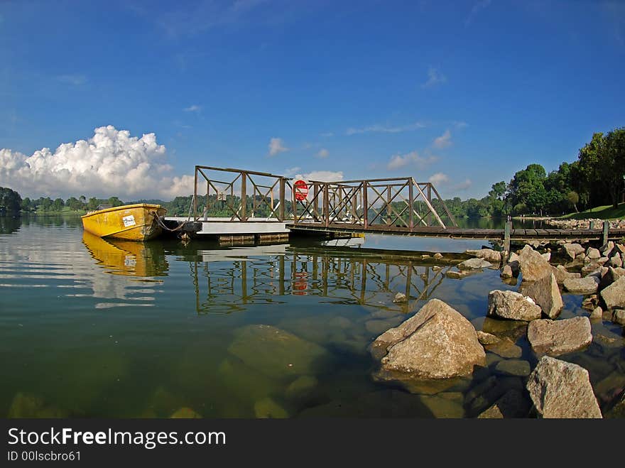 Yellow boat in the reservoir